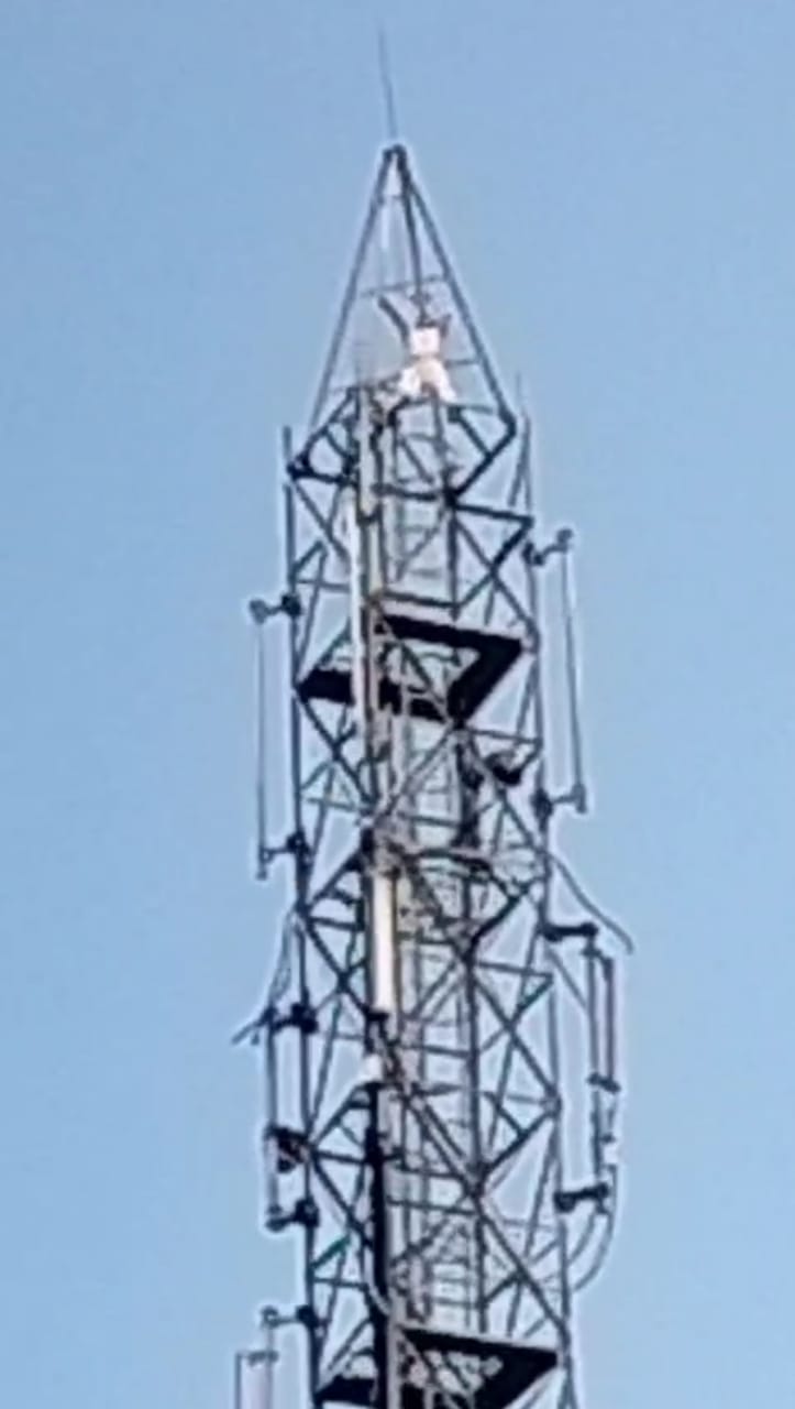 man climbing tower