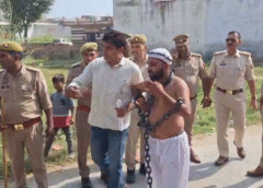 A young man in chains arrived at Imran Masood's home