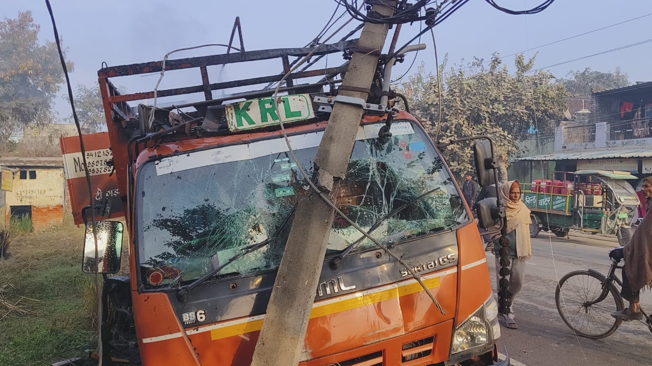 A truck loaded with wooden toys collided with a pole
