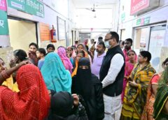 Deputy CM Brajesh Pathak stands in line as a patient at the Chinhat CHC in Lucknow.
