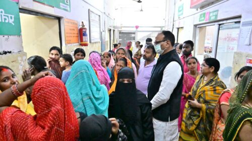 Deputy CM Brajesh Pathak stands in line as a patient at the Chinhat CHC in Lucknow.