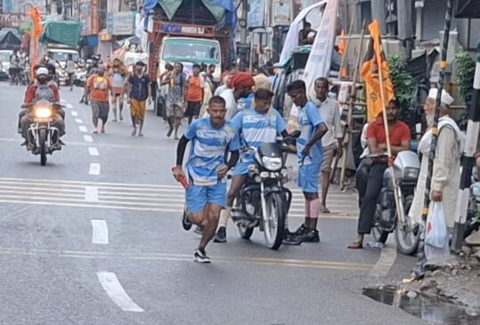 After the padayatra it's now the turn of the dak kanwad, Shiva devotees racing on the roads with bikes and cars.